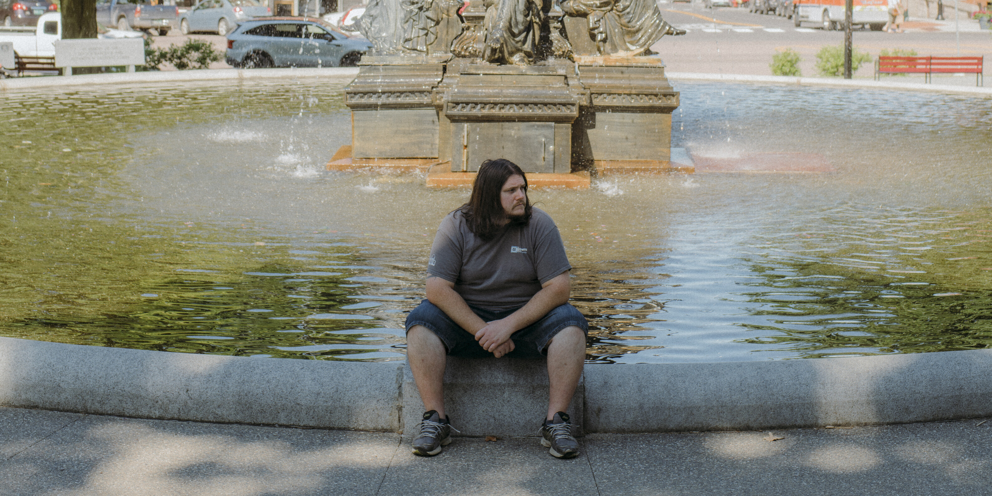 Sean portrait, seated at St. Albans fountain.
