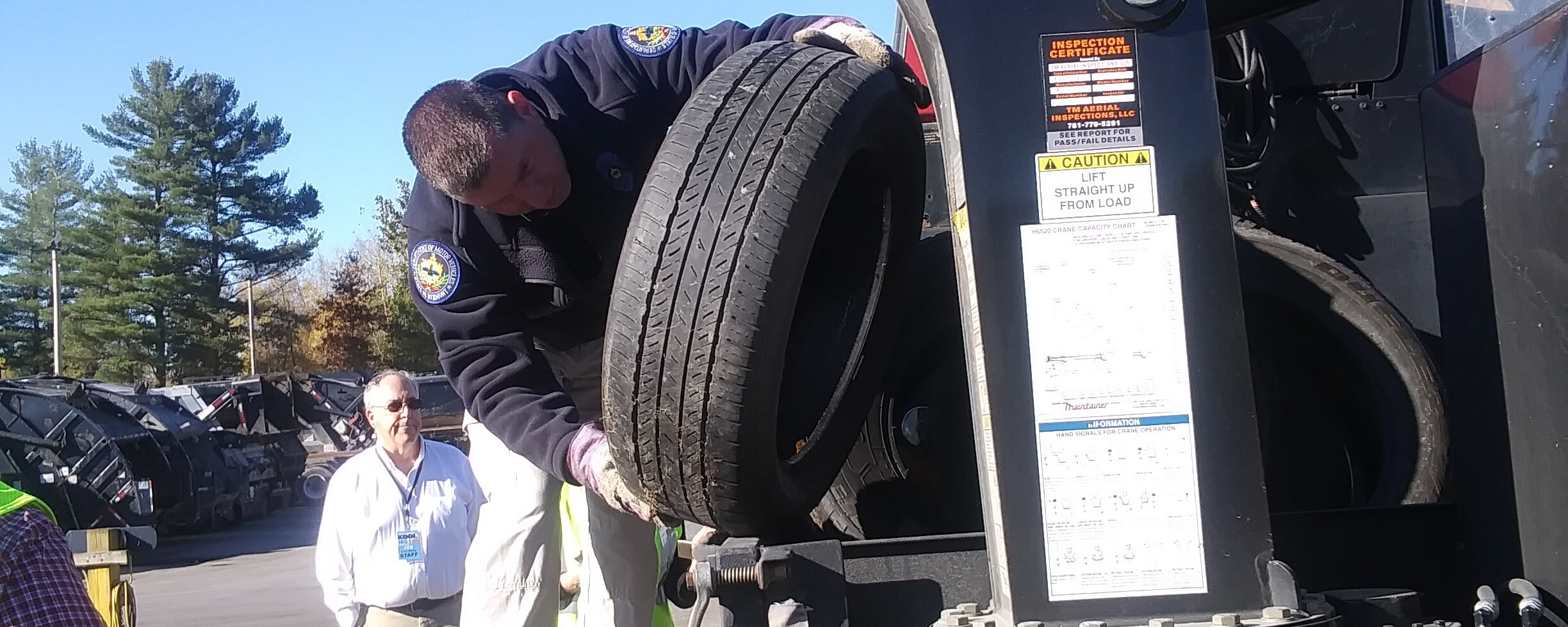a man lifting a car tire